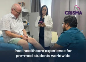 Pre-med students volunteering in an international healthcare clinic and assisting medical staff